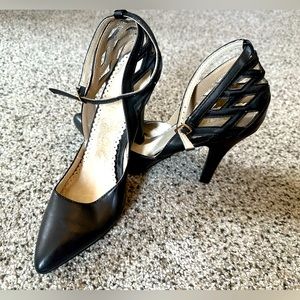 Black ankle strap heels.